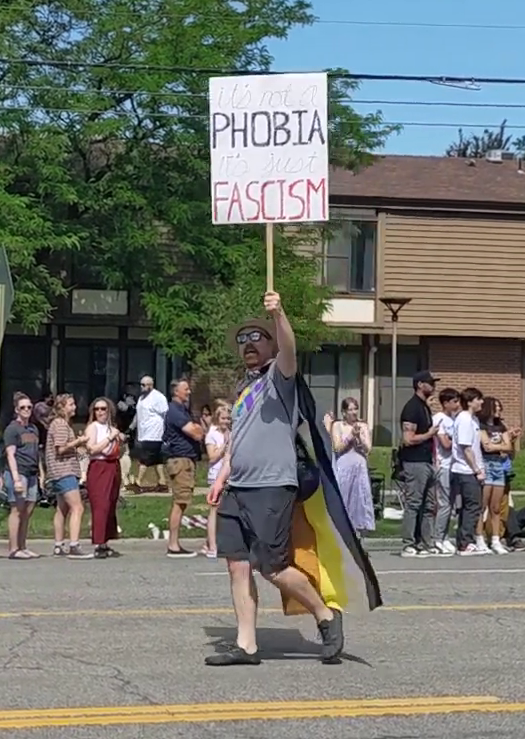 me holding a sign that reads "it's not a phobia, it's just fascism"